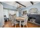 Charming dining room with hardwood floors, a fireplace, and a wooden dining table at 525 W Blue Springs Ave, Orange City, FL 32763