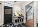 Stylish mudroom with decorative floors, storage cabinet, and modern decor at 525 W Blue Springs Ave, Orange City, FL 32763
