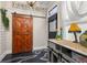 Stylish mud room with sliding barn door, decorative floor, and lots of storage at 525 W Blue Springs Ave, Orange City, FL 32763