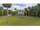 Charming two-story home with a large yard, palm trees and detached garage at 525 W Blue Springs Ave, Orange City, FL 32763