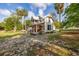 Elegant two-story home with a front porch and manicured lawn showcasing curb appeal at 525 W Blue Springs Ave, Orange City, FL 32763