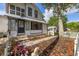 Charming two-story home with a screened porch, and well-manicured landscaping at 525 W Blue Springs Ave, Orange City, FL 32763