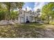Charming two-story home with a white picket fence, and well-manicured lawn at 525 W Blue Springs Ave, Orange City, FL 32763