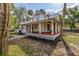 Charming two-story home with a inviting front porch, perfect for relaxing outdoors at 525 W Blue Springs Ave, Orange City, FL 32763