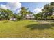 Spacious property with a charming house, detached garage, and lush greenery, providing a serene and inviting atmosphere at 525 W Blue Springs Ave, Orange City, FL 32763