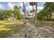 Gorgeous two-story home with a wrap-around porch, mature trees, and detached garage at 525 W Blue Springs Ave, Orange City, FL 32763