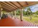 View of the expansive front porch, featuring its ample space, seating, and lovely outdoor ambiance at 525 W Blue Springs Ave, Orange City, FL 32763