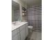 Bathroom featuring a modern vanity with a white countertop and striped shower curtain at 537 S Andrea Cir, Haines City, FL 33844