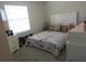 Bedroom with a bed, a window, and a dresser at 537 S Andrea Cir, Haines City, FL 33844