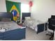 Bedroom with two beds, a Brazilian flag, and a Japanese lantern at 537 S Andrea Cir, Haines City, FL 33844