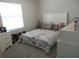 Bedroom with a bed, a window, and a dresser at 537 S Andrea Cir, Haines City, FL 33844
