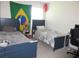 Bedroom with two beds, a Brazilian flag, and a Japanese lantern at 537 S Andrea Cir, Haines City, FL 33844