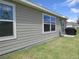 Exterior shot of a home with siding, showing a backyard with grass at 537 S Andrea Cir, Haines City, FL 33844