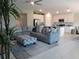 Comfortable living room seamlessly flows into a modern kitchen and dining space, perfect for entertaining at 537 S Andrea Cir, Haines City, FL 33844