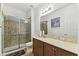 Bathroom with glass shower, vanity with stone countertop, and mosaic tile at 561 Tapatio Ln, Kissimmee, FL 34759