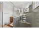 Modern bathroom boasts granite counters, seamless glass shower, and modern hardware at 561 Tapatio Ln, Kissimmee, FL 34759