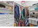 Walk-in closet equipped with ample shelving and hanging space for clothing and accessories at 561 Tapatio Ln, Kissimmee, FL 34759