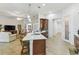 Spacious open-concept kitchen featuring stainless appliances, quartz countertops, and an adjacent living area for entertaining at 561 Tapatio Ln, Kissimmee, FL 34759