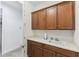 Laundry room with sink and custom cabinets at 561 Tapatio Ln, Kissimmee, FL 34759