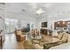 Open-concept living room seamlessly connects to the kitchen and dining area, ideal for modern living at 561 Tapatio Ln, Kissimmee, FL 34759