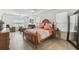 Bright main bedroom features a ceiling fan, seating area, wood furniture, and natural light from the windows at 561 Tapatio Ln, Kissimmee, FL 34759