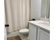 Bathroom showcasing a modern vanity with white countertop and a shower/tub with curtain at 5725 Iron Brand Rd, St Cloud, FL 34771