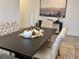 Warm dining room with modern table and chairs, decorative accents, and stylish artwork at 5725 Iron Brand Rd, St Cloud, FL 34771