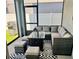 Stylish screened-in patio with comfortable seating, outdoor rug, and a BBQ grill, ideal for entertaining at 5725 Iron Brand Rd, St Cloud, FL 34771