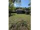 The backyard has a storage shed, mature trees, and a well-maintained lawn at 6489 Creation St, St Cloud, FL 34771