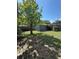 Fenced backyard featuring a storage shed and mature trees that provide plenty of shade at 6489 Creation St, St Cloud, FL 34771