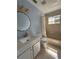 Bright bathroom featuring a vanity with drawers, toilet, and bathtub with shower at 6489 Creation St, St Cloud, FL 34771