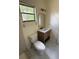 Bathroom featuring a walk-in shower, toilet, and vanity with drawers at 6489 Creation St, St Cloud, FL 34771
