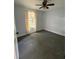 Cozy bedroom with a ceiling fan, a window, neutral paint, and wall-to-wall carpeting at 6489 Creation St, St Cloud, FL 34771
