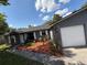 This single-Gathering home features stone accents, a well-manicured lawn, and a two-car garage at 6489 Creation St, St Cloud, FL 34771