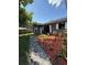 Inviting front yard with stone walkway, fresh mulch, and charming landscaping leading to a well-maintained gray home at 6489 Creation St, St Cloud, FL 34771