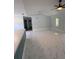 Open concept living room with access to the kitchen and stunning marble floors at 6489 Creation St, St Cloud, FL 34771