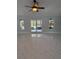 Spacious living room with large windows offering lots of natural light and elegant marble floors at 6489 Creation St, St Cloud, FL 34771