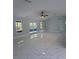 Spacious living room featuring a sliding glass door to the backyard and elegant marble floors at 6489 Creation St, St Cloud, FL 34771