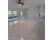 Spacious living room featuring a sliding glass door to the backyard and elegant marble floors at 6489 Creation St, St Cloud, FL 34771