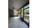 Enclosed patio with screening and view of backyard at 6489 Creation St, St Cloud, FL 34771