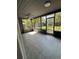 Inviting screened porch with a ceiling fan and views of the backyard at 6489 Creation St, St Cloud, FL 34771