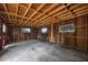 Unfinished basement featuring exposed wood framing and concrete flooring provides a blank canvas for your dream design at 710 Carlton Ave, Lake Wales, FL 33853