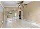 Bedroom featuring tiled flooring, a mirrored closet, and neutral colored walls at 710 Carlton Ave, Lake Wales, FL 33853