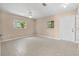 Bedroom with tile floors, a ceiling fan, and a pair of windows allowing for lots of light at 710 Carlton Ave, Lake Wales, FL 33853