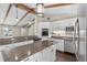 Bright kitchen featuring granite countertops, stainless steel appliances, and a center island at 710 Carlton Ave, Lake Wales, FL 33853