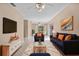 Comfortable living room is decorated with furniture and a large rug at 710 Carlton Ave, Lake Wales, FL 33853