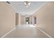 Spacious living room with tile floors, ceiling fan and sliding glass doors to the lanai at 710 Carlton Ave, Lake Wales, FL 33853