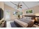 Nicely staged main bedroom featuring tiled floors, updated furnishings and lots of natural light at 710 Carlton Ave, Lake Wales, FL 33853