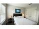 Well-lit bedroom with a double bed, and a large window with blinds at 8517 Bay Lilly Loop, Kissimmee, FL 34747
