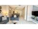 Open-concept living and dining area with tile floors and neutral decor at 8517 Bay Lilly Loop, Kissimmee, FL 34747